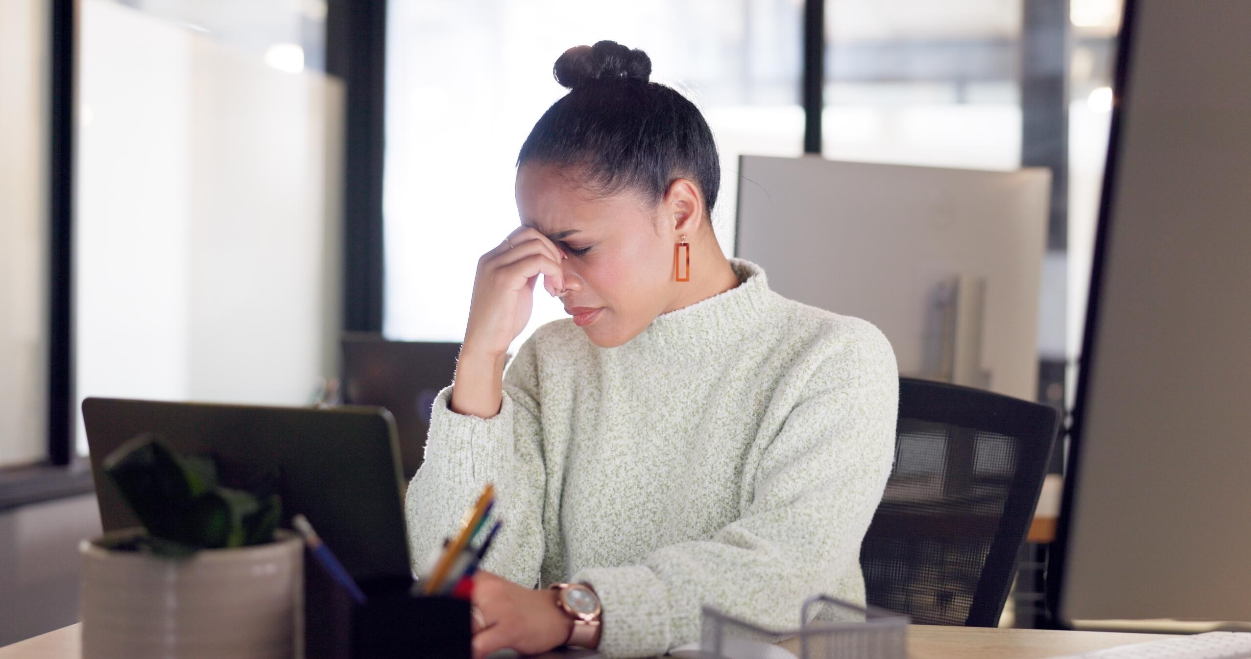 Business owner looking at phone with missed call notifications showing lost revenue opportunity